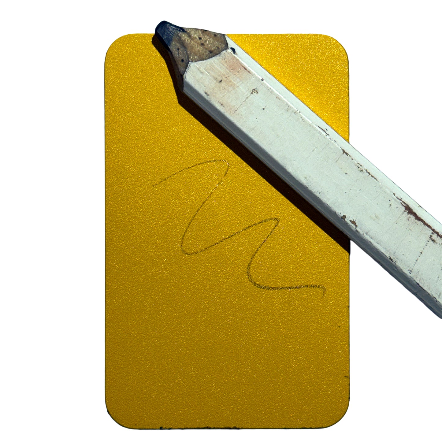 Yellow Worx Writes Business Card pad with graphite pencil scribble and a worn pencil resting on top.